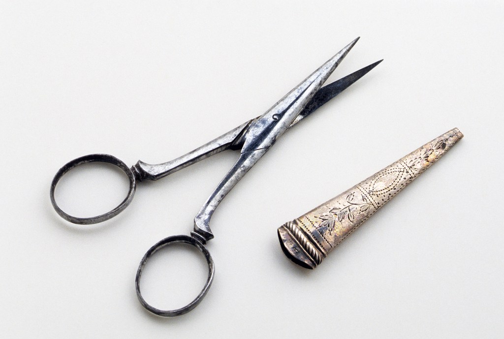 Unknown maker. Scissors and sheath. 1800-35. England, United Kingdom. Iron, silver and steel. Museum purchase with funds provided by The Embroiderers' Guild of America: Courtesy of Winterthur Museum. 1990.0031 A, B. https://www.winterthur.org/