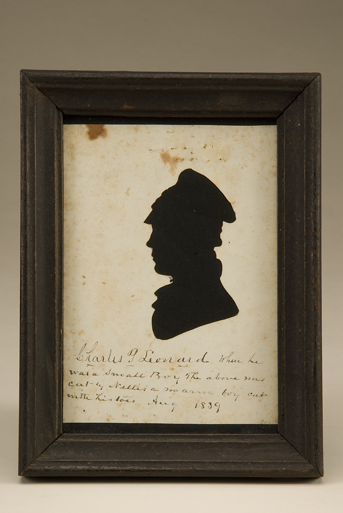 Silhouette portrait of young man with cap.
