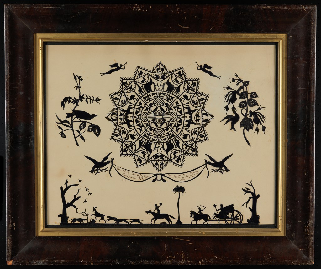 Papercut of fox hunt, birds with flowers